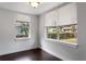 Bright bedroom with dark hardwood floors and window at 1713 E Chelsea St, Tampa, FL 33610