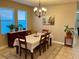 Formal dining room with chandelier and wooden dining set at 2117 Valterra Vista Way, Valrico, FL 33594