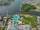 Aerial view of community pool, lake, and surrounding homes at 618 Islebay Dr, Apollo Beach, FL 33572