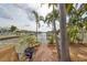 Relaxing patio space with canal view and lush landscaping at 618 Islebay Dr, Apollo Beach, FL 33572