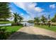 Private boat ramp with lush landscaping leading to a calm canal at 618 Islebay Dr, Apollo Beach, FL 33572