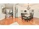 Formal dining room with hardwood floors, chandelier, and large table at 618 Islebay Dr, Apollo Beach, FL 33572