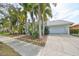 House exterior with palm trees, landscaped yard and driveway at 618 Islebay Dr, Apollo Beach, FL 33572