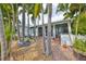 Charming entryway with lush landscaping and screened porch at 618 Islebay Dr, Apollo Beach, FL 33572