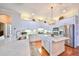 Modern kitchen featuring white cabinets, stainless steel appliances, and hardwood floors at 618 Islebay Dr, Apollo Beach, FL 33572