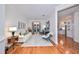 Living room with off-white sofa, hardwood floors, and access to patio at 618 Islebay Dr, Apollo Beach, FL 33572