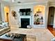 Living room with fireplace and built-in shelving at 618 Islebay Dr, Apollo Beach, FL 33572