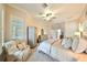 Main bedroom with comfortable seating area and water views at 618 Islebay Dr, Apollo Beach, FL 33572