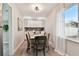 Bright dining area with a table for four and white curtains at 6338 8Th S Ave, Gulfport, FL 33707