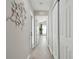 Light and airy hallway with grey walls and white doors at 6338 8Th S Ave, Gulfport, FL 33707