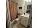 Clean bathroom with shower/tub combo, vanity, and white cabinetry at 11712 Stonesmith Xing, Palmetto, FL 34221