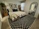 Main bedroom with a king-size bed and black and white rug at 11712 Stonesmith Xing, Palmetto, FL 34221