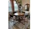 Round dining table with four chairs and decorative rug at 11712 Stonesmith Xing, Palmetto, FL 34221