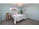 Bright bedroom with a double bed and light blue walls at 1875 Stetson Dr, Clearwater, FL 33765