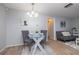 Small dining area with glass table and gray chairs at 1875 Stetson Dr, Clearwater, FL 33765