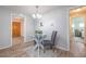 Bright dining area with glass table and gray chairs, near the entrance at 1875 Stetson Dr, Clearwater, FL 33765