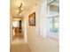 Bright hallway with tile flooring and artwork at 218 6Th Sw Ave, Ruskin, FL 33570