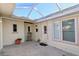 Covered patio with rocking chair and potted plants at 218 6Th Sw Ave, Ruskin, FL 33570