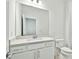 Bathroom featuring a vanity with a quartz countertop and white cabinets at 3584 Maple Bay Ln, Land O Lakes, FL 34638