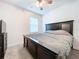 Spacious bedroom with king-size bed and dark wood furniture at 6119 Bradford Woods Dr, Zephyrhills, FL 33542