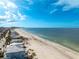 Aerial view of beach, ocean and homes at 851 Mandalay Ave, Clearwater Beach, FL 33767