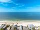 Aerial view of beach, ocean and homes at 851 Mandalay Ave, Clearwater Beach, FL 33767