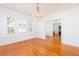 Bright dining room, hardwood floors, chandelier, view to entry at 2528 W Sunset Dr, Tampa, FL 33629