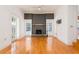 Bright living room with hardwood floors, fireplace, and French doors leading to patio at 2528 W Sunset Dr, Tampa, FL 33629