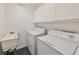 Laundry room with washer, dryer, and utility sink at 2966 Brookfield Ln, Clearwater, FL 33761