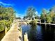 Scenic waterfront view of a community dock with wooden beams and calming water at 5227 Dayton Ln, Port Charlotte, FL 33981