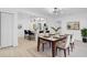 Bright dining room with table and chairs, adjacent to kitchen at 1009 Farragut N Dr, St Petersburg, FL 33710