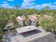 Aerial view of condo complex with covered parking at 3505 Tarpon Woods Blvd # K409, Palm Harbor, FL 34685