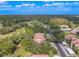 Wide aerial view showing the community's location near a golf course at 3505 Tarpon Woods Blvd # K409, Palm Harbor, FL 34685