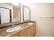 Double vanity bathroom with neutral tones and a shower/tub combo at 3505 Tarpon Woods Blvd # K409, Palm Harbor, FL 34685