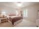 Bright bedroom with plush carpeting and a queen-size bed at 3505 Tarpon Woods Blvd # K409, Palm Harbor, FL 34685