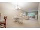 Bright dining area with table and access to living room at 3505 Tarpon Woods Blvd # K409, Palm Harbor, FL 34685