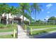 Community clubhouse with welcoming entryway and landscaping at 3505 Tarpon Woods Blvd # K409, Palm Harbor, FL 34685