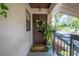 Inviting condo entry with a wreath and potted plants at 3505 Tarpon Woods Blvd # K409, Palm Harbor, FL 34685