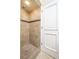 Walk-in shower with neutral tile and a single shower head at 3505 Tarpon Woods Blvd # K409, Palm Harbor, FL 34685