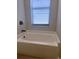 Bathroom with a bathtub and modern fixtures at 5479 Brussels Ter, Port Charlotte, FL 33981