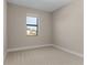 Empty bedroom with carpet, a window, and freshly painted walls at 5479 Brussels Ter, Port Charlotte, FL 33981