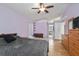 Bright bedroom featuring wood floors and access to the bathroom at 6028 Dorset Rd, Spring Hill, FL 34608