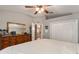 Comfortable primary bedroom with vaulted ceilings, closet and an en-suite bath at 6028 Dorset Rd, Spring Hill, FL 34608