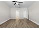 Spacious bedroom with a ceiling fan and two entryways at 12140 Warden Ave, Port Charlotte, FL 33981