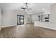 Open living room featuring a ceiling fan, recessed lighting, and sliding glass doors at 12140 Warden Ave, Port Charlotte, FL 33981