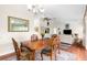 Traditional dining room with hardwood floors and a wood table at 2833 Windridge Dr, Holiday, FL 34691