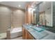 Modern bathroom with glass vessel sinks, walk-in shower, soaking tub, and stylish tile at 400 4Th S Ave # 508, St Petersburg, FL 33701