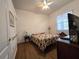 Charming bedroom with a floral bedspread and a window at 17820 Monteverde Dr, Spring Hill, FL 34610