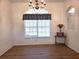 Bright dining room with large window and chandelier at 17820 Monteverde Dr, Spring Hill, FL 34610