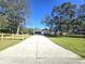 Long driveway leading to a single-story home at 17820 Monteverde Dr, Spring Hill, FL 34610